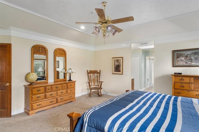 carpeted bedroom featuring a ceiling fan, a tray ceiling, baseboards, and crown molding