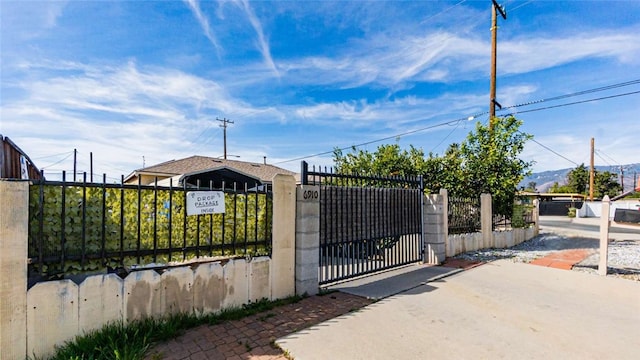 view of gate featuring a fenced front yard