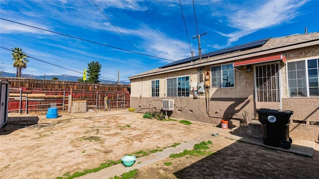 view of yard featuring fence and a mountain view