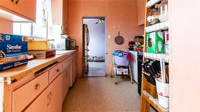 kitchen featuring light floors and light countertops