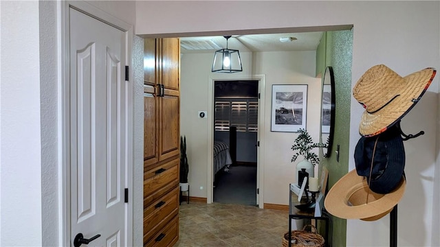 hallway featuring baseboards