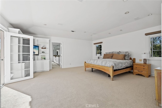 bedroom with light carpet, vaulted ceiling, recessed lighting, and baseboards