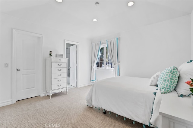 bedroom with light carpet and recessed lighting