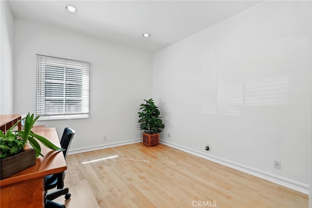 home office with baseboards, light wood-type flooring, and recessed lighting