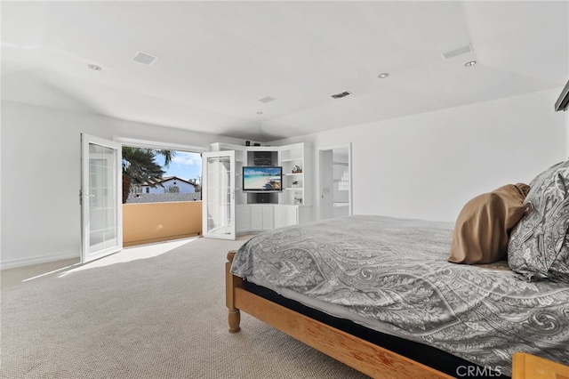 bedroom featuring light carpet, access to exterior, visible vents, and french doors