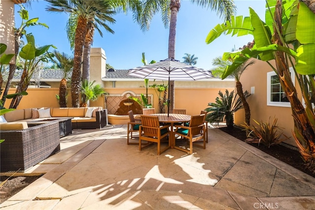 view of patio with fence, an outdoor living space, and outdoor dining space