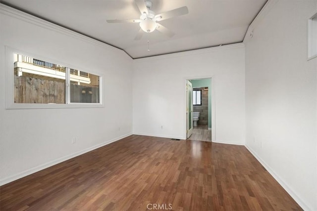 unfurnished room with ornamental molding, ceiling fan, baseboards, and wood finished floors