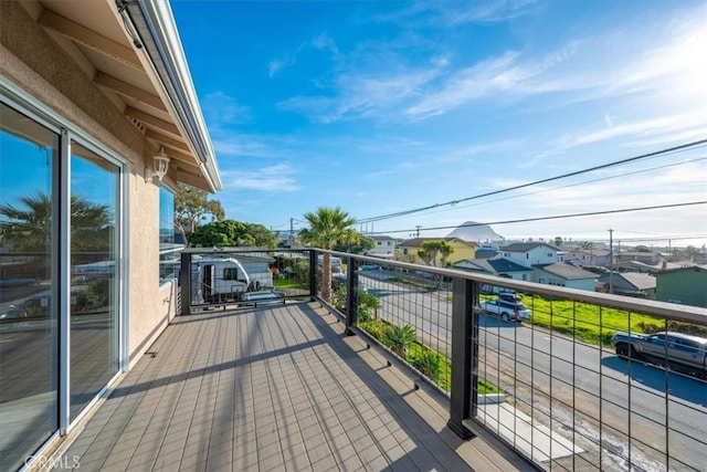 wooden deck with a residential view