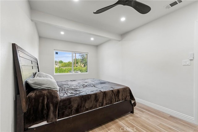 bedroom featuring light wood finished floors, baseboards, visible vents, and recessed lighting