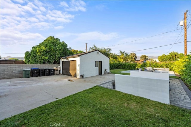 view of yard featuring an outdoor structure and fence