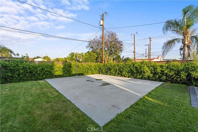 exterior space with fence and basketball court