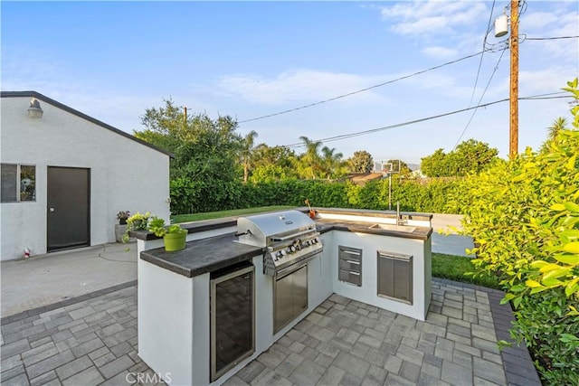 view of patio / terrace featuring wine cooler, grilling area, and area for grilling