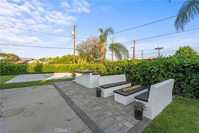 view of patio / terrace featuring an outdoor fire pit