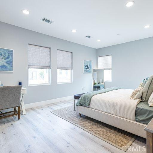 bedroom featuring recessed lighting, visible vents, and light wood-style floors