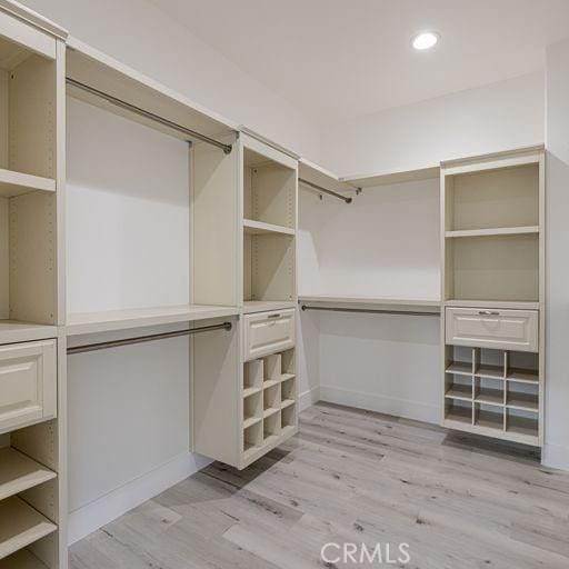 walk in closet featuring light wood-type flooring