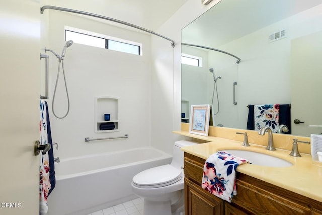 full bath featuring visible vents, toilet, tub / shower combination, vanity, and tile patterned flooring