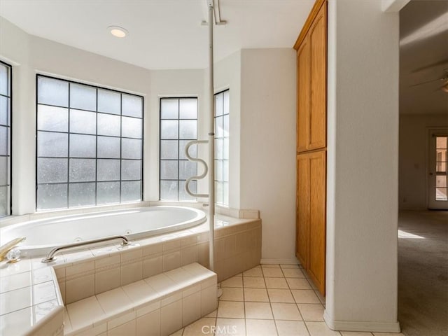 bathroom featuring a garden tub and tile patterned floors