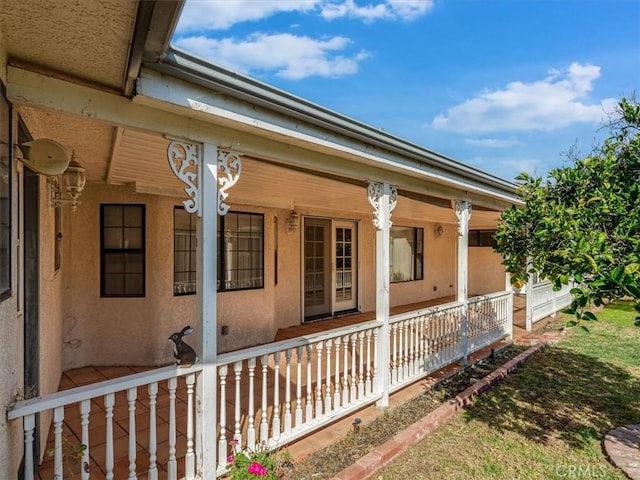 view of home's exterior featuring covered porch and stucco siding