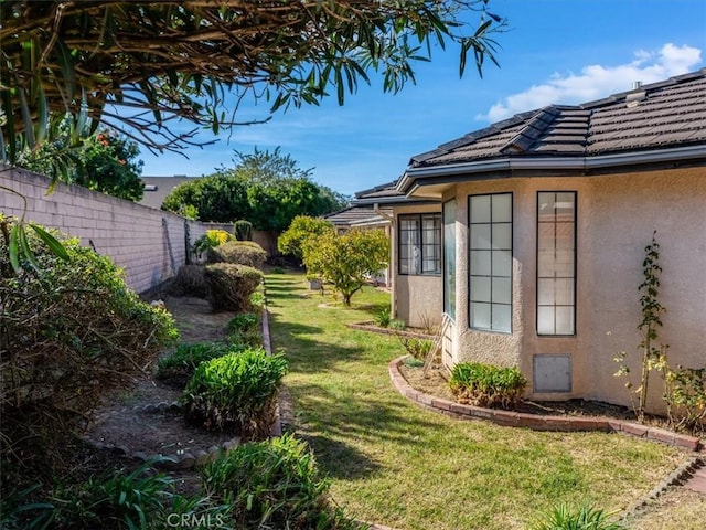 view of yard with a fenced backyard