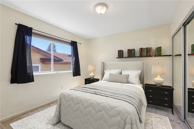 bedroom featuring light carpet