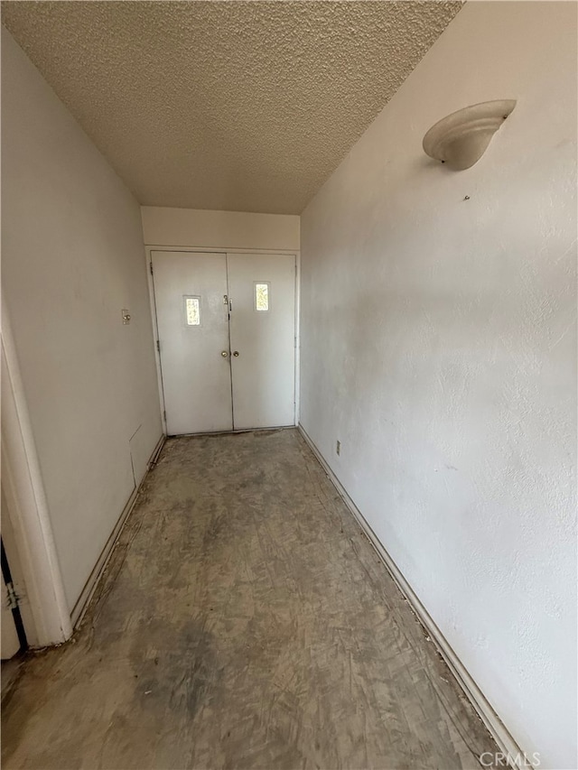 interior space with a textured ceiling