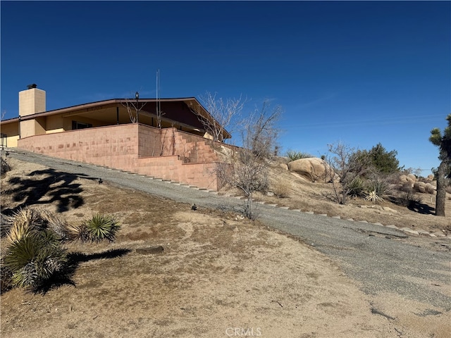 view of side of property featuring a chimney