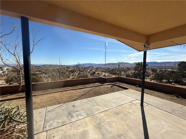 view of patio featuring a mountain view