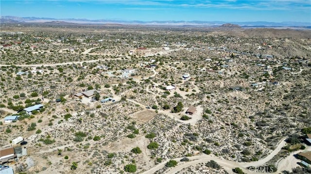 drone / aerial view with a mountain view and a desert view