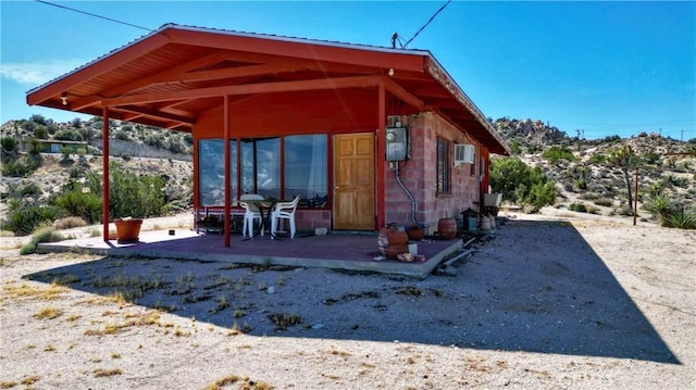 rear view of property featuring a patio