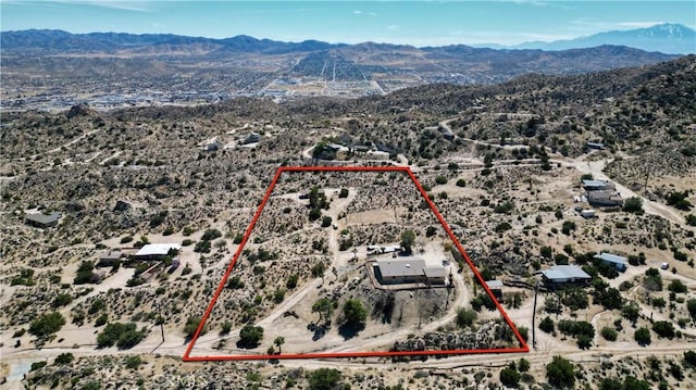 bird's eye view featuring view of desert and a mountain view