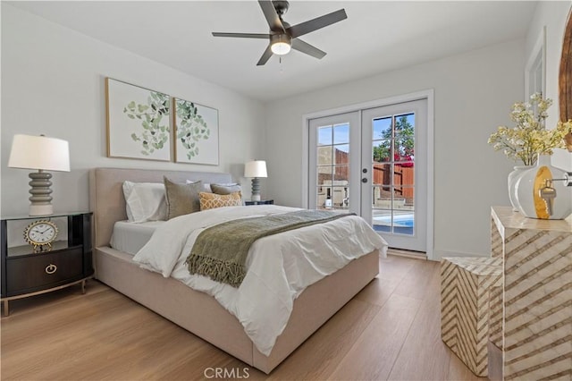 bedroom with light wood-type flooring, access to outside, french doors, and ceiling fan