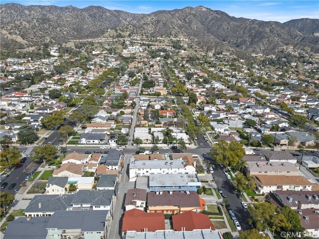 drone / aerial view featuring a residential view and a mountain view