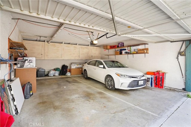 parking garage featuring a garage door opener