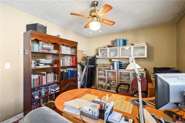 home office with a textured ceiling and a ceiling fan