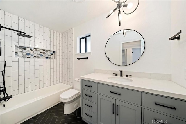 full bathroom featuring shower / tub combination, vanity, and toilet