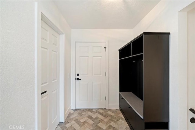 mudroom featuring baseboards