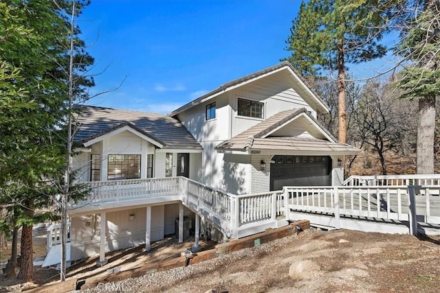 view of front of property featuring covered porch and brick siding