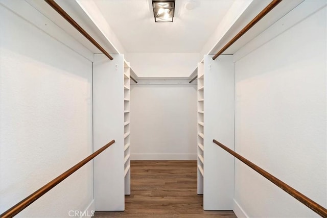 spacious closet with wood finished floors