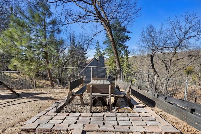 view of jungle gym featuring fence