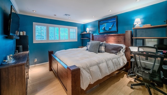 bedroom with light wood finished floors, baseboards, crown molding, and recessed lighting