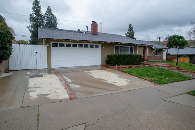 single story home with stucco siding, an attached garage, a gate, fence, and driveway