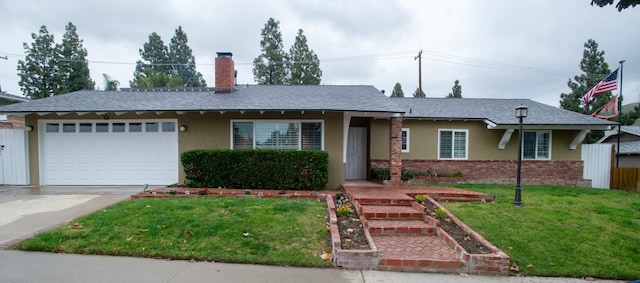 ranch-style house with brick siding, stucco siding, a front yard, a garage, and driveway