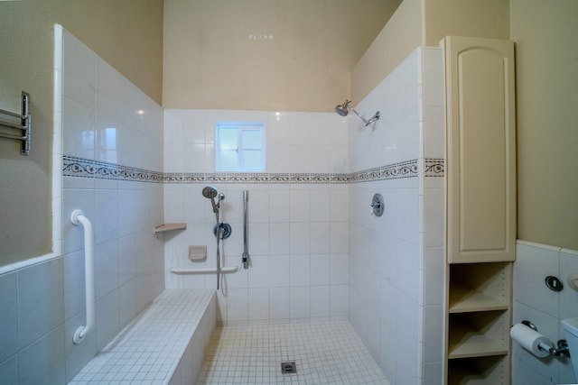 full bath with a tile shower