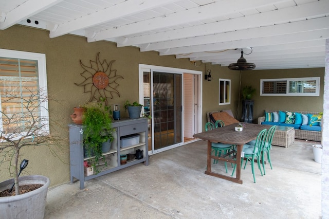 view of patio / terrace with ceiling fan and an outdoor living space