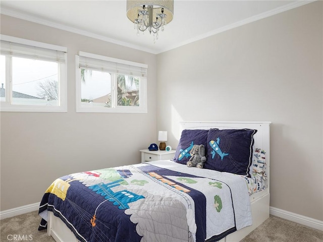 bedroom with baseboards, carpet flooring, and ornamental molding