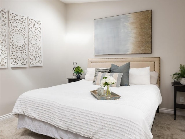 bedroom featuring carpet floors and baseboards