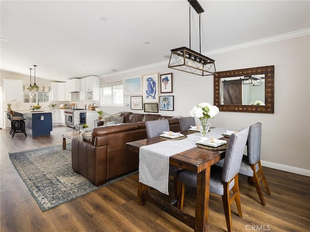 dining room with dark wood-style floors, baseboards, and crown molding