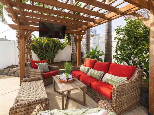 view of patio featuring a fenced backyard, an outdoor living space, and a pergola