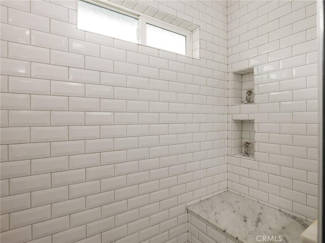 bathroom featuring a tile shower