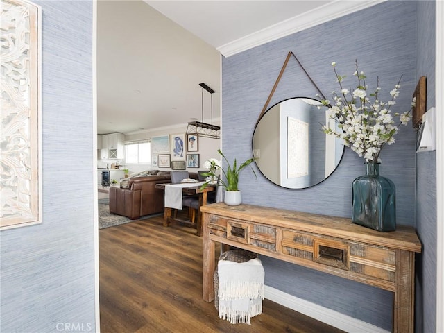 corridor with crown molding and wood finished floors